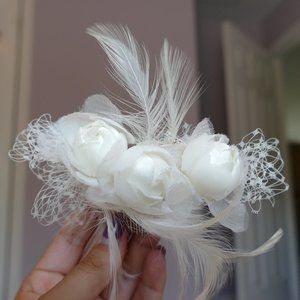 Rose, feather, and fishnet bridal hair piece